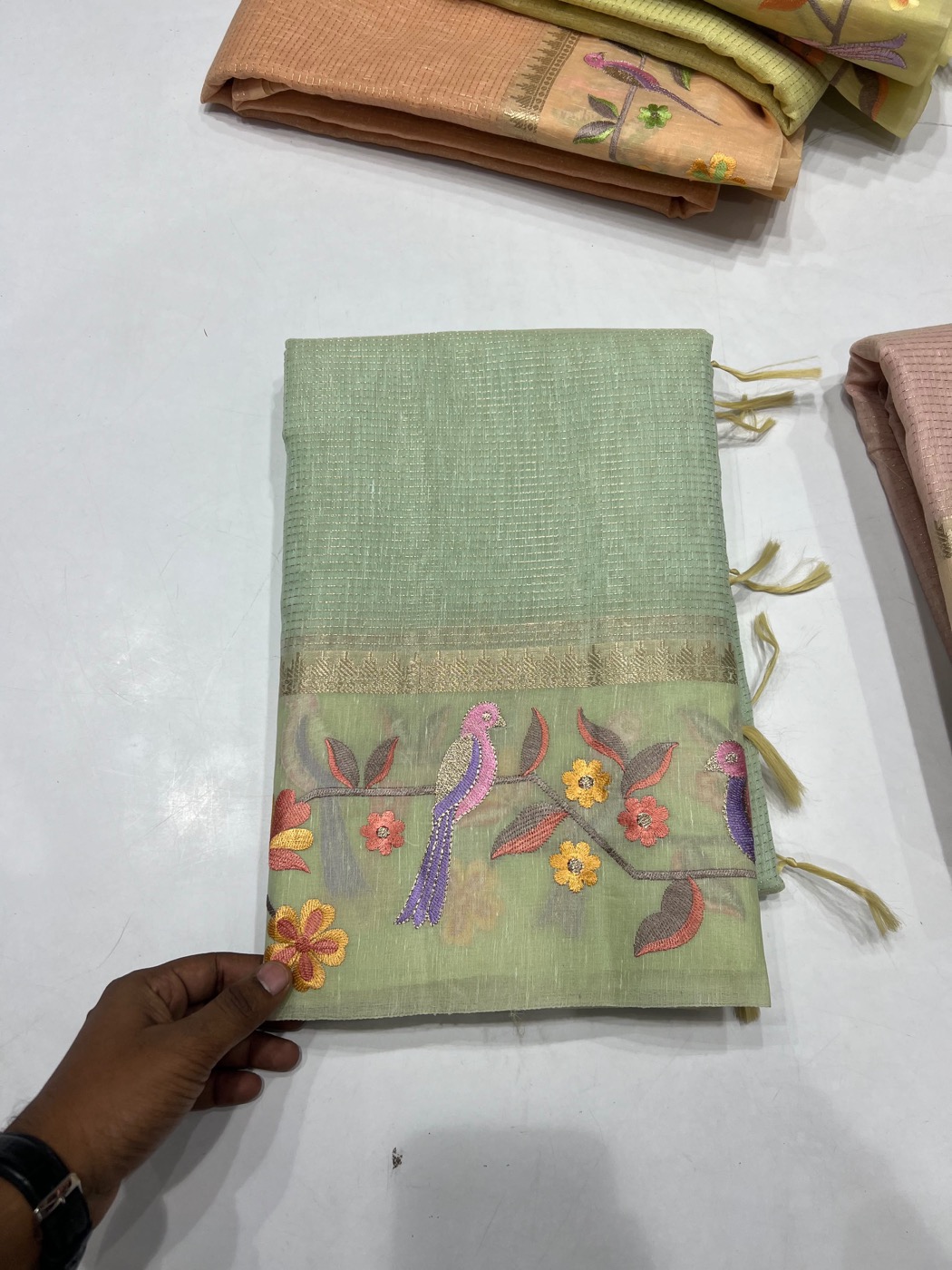 Sage saree with embroidered birds and floral motifs