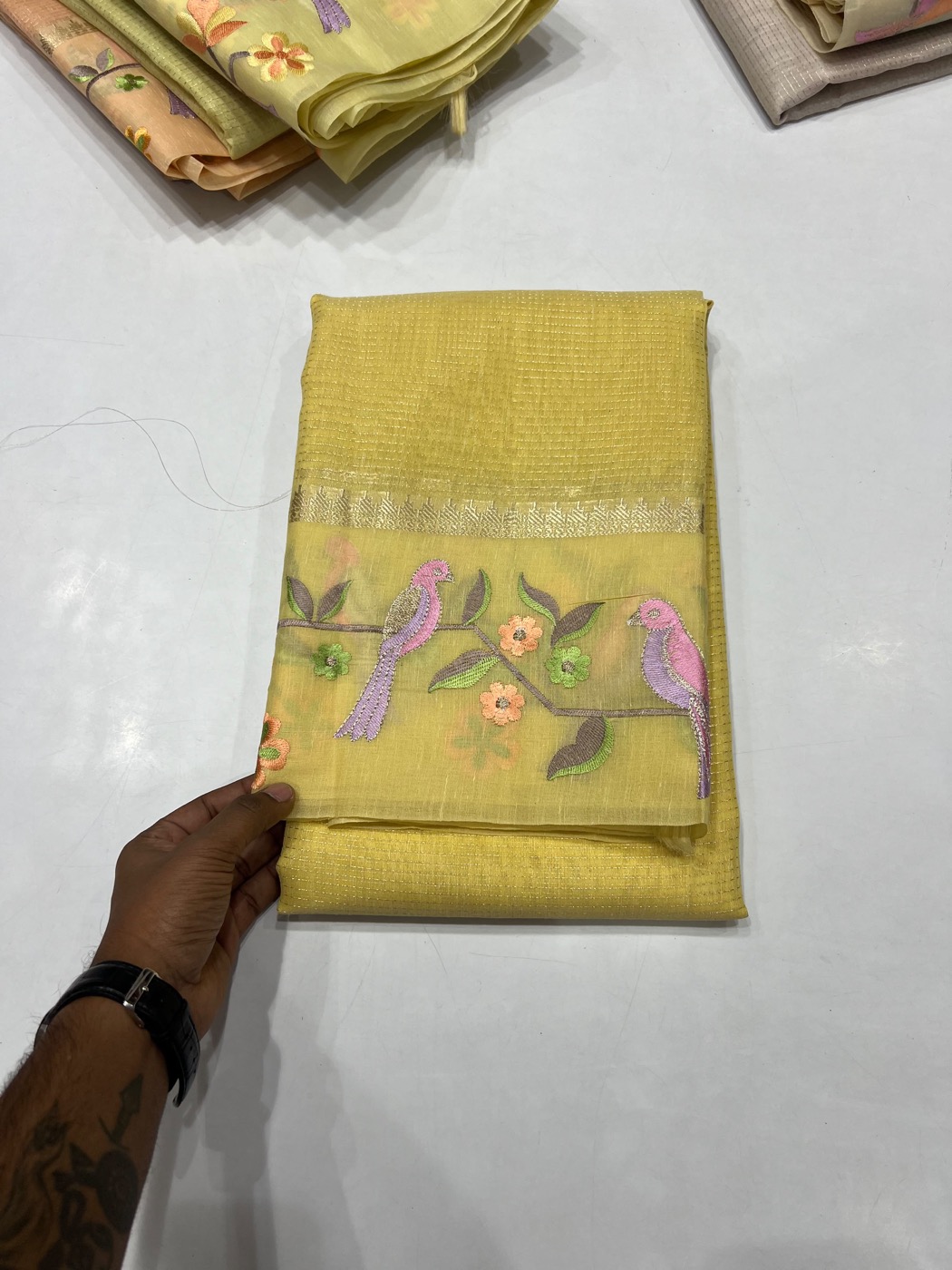 Yellow saree with embroidered birds and floral motifs